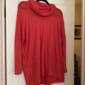 Size large soft sweater in light coral color, size medium.